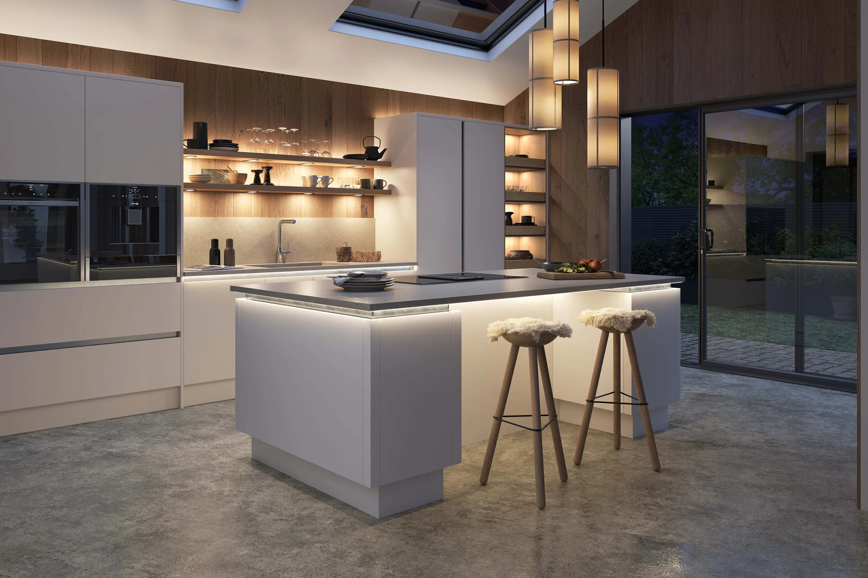 Modern kitchen with white cabinets, wooden shelves with dishes, illuminated island with two furry stools, and glass sliding door showing outdoor area at dusk.